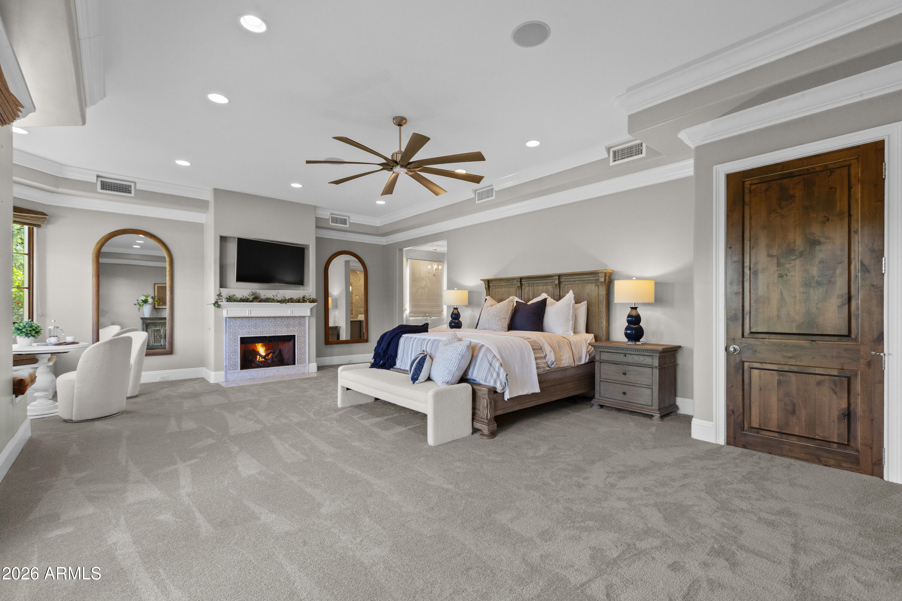 4909 North 45th Place Phoenix, AZ 85018 - Photo 18 of 45 a bed room with furniture and a chandelier