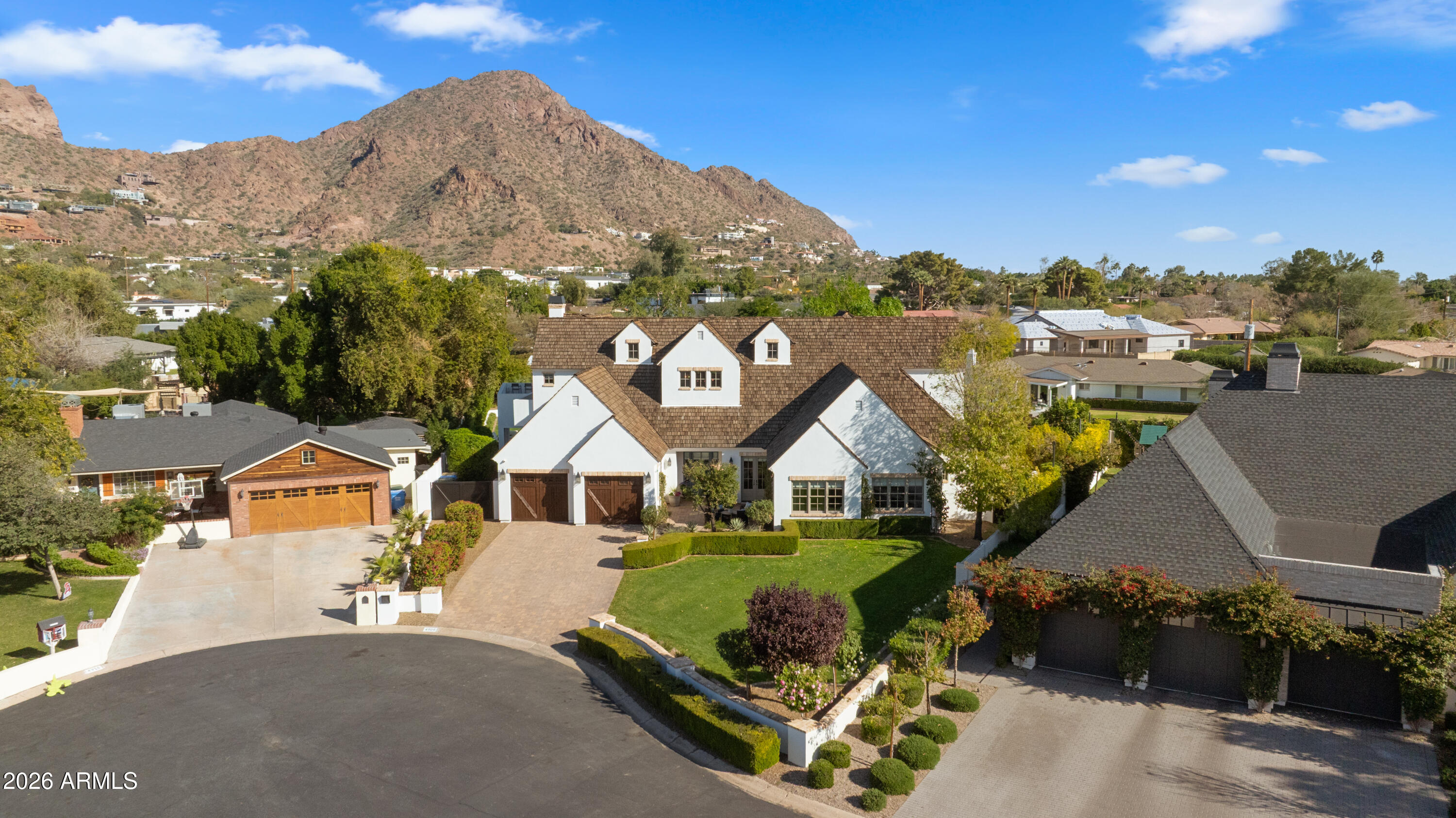 4909 North 45th Place Phoenix, AZ 85018 - Photo 2 of 45 a front view of a house with a yard