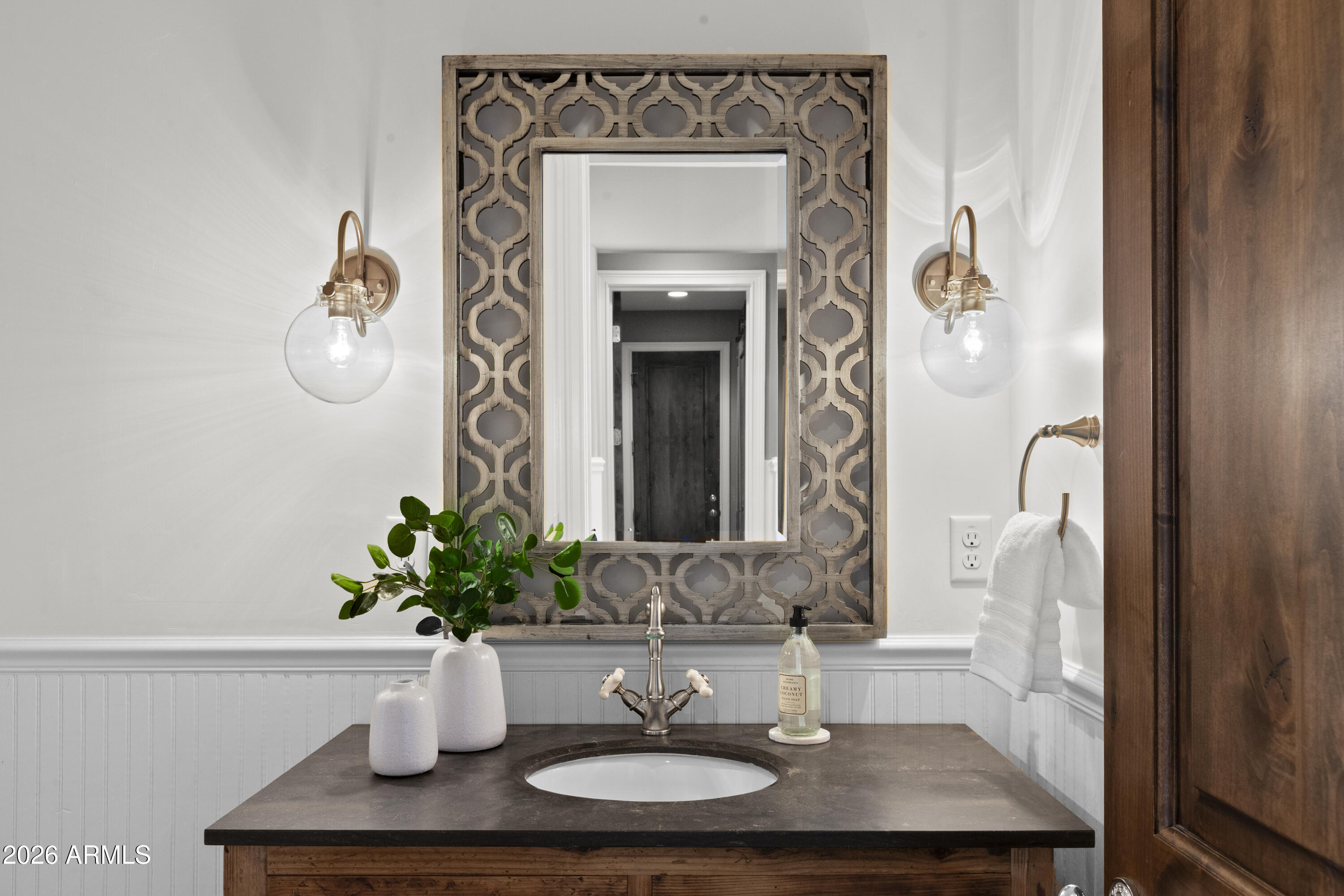 4909 North 45th Place Phoenix, AZ 85018 - Photo 24 of 45 a bathroom with a sink a toilet and mirror