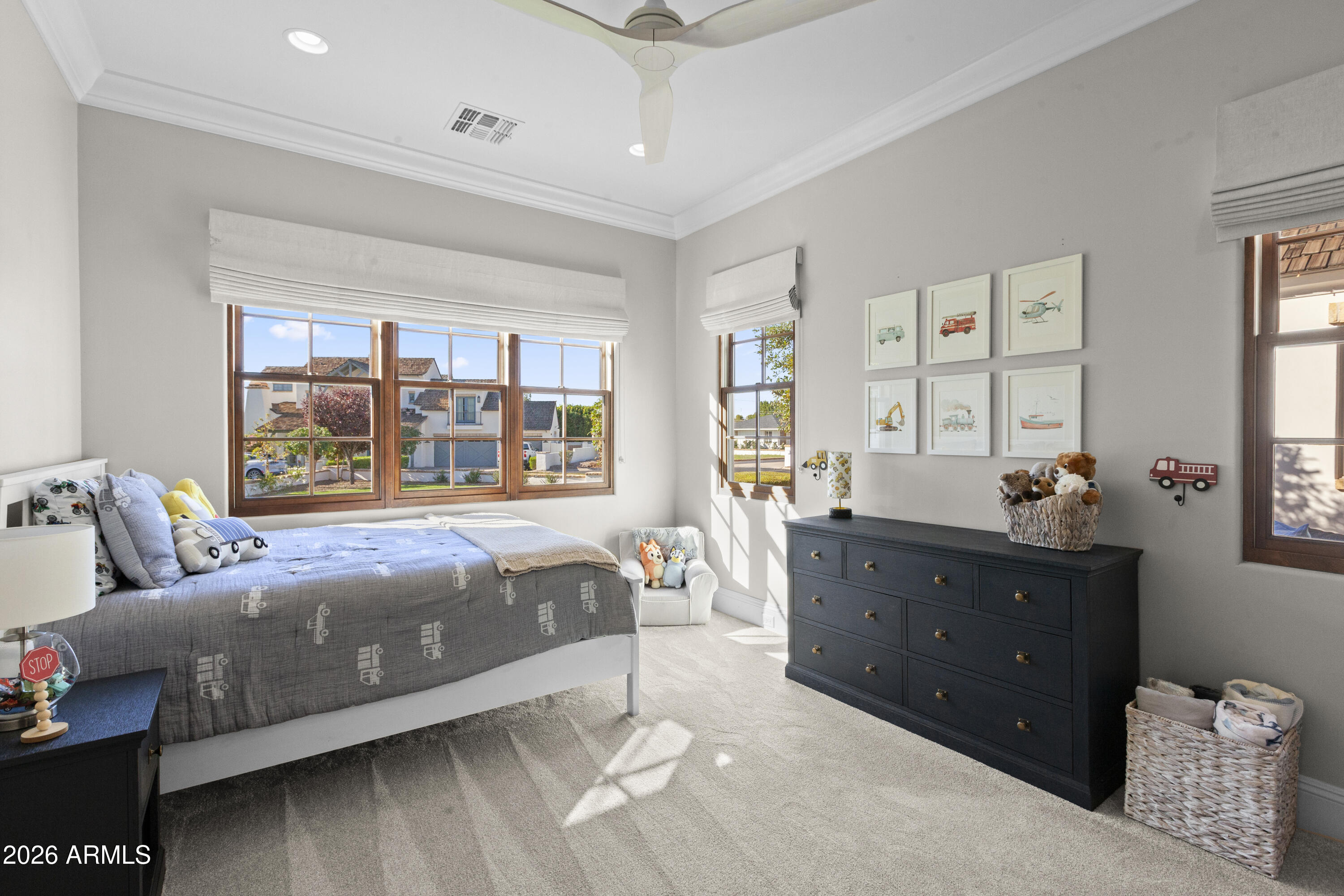 4909 North 45th Place Phoenix, AZ 85018 - Photo 25 of 45 a bed room with a bed and a window