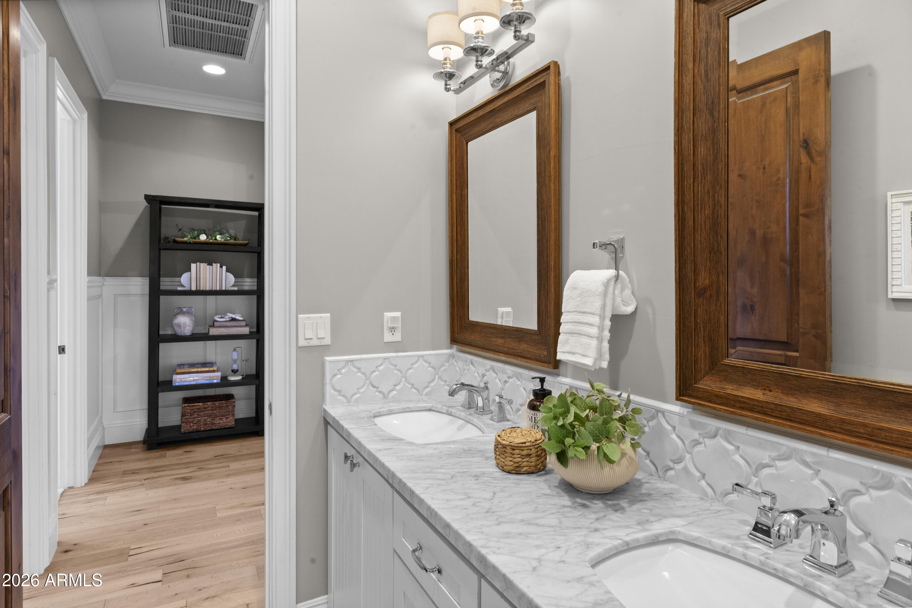 4909 North 45th Place Phoenix, AZ 85018 - Photo 26 of 45 a bathroom with a granite countertop sink and a mirror