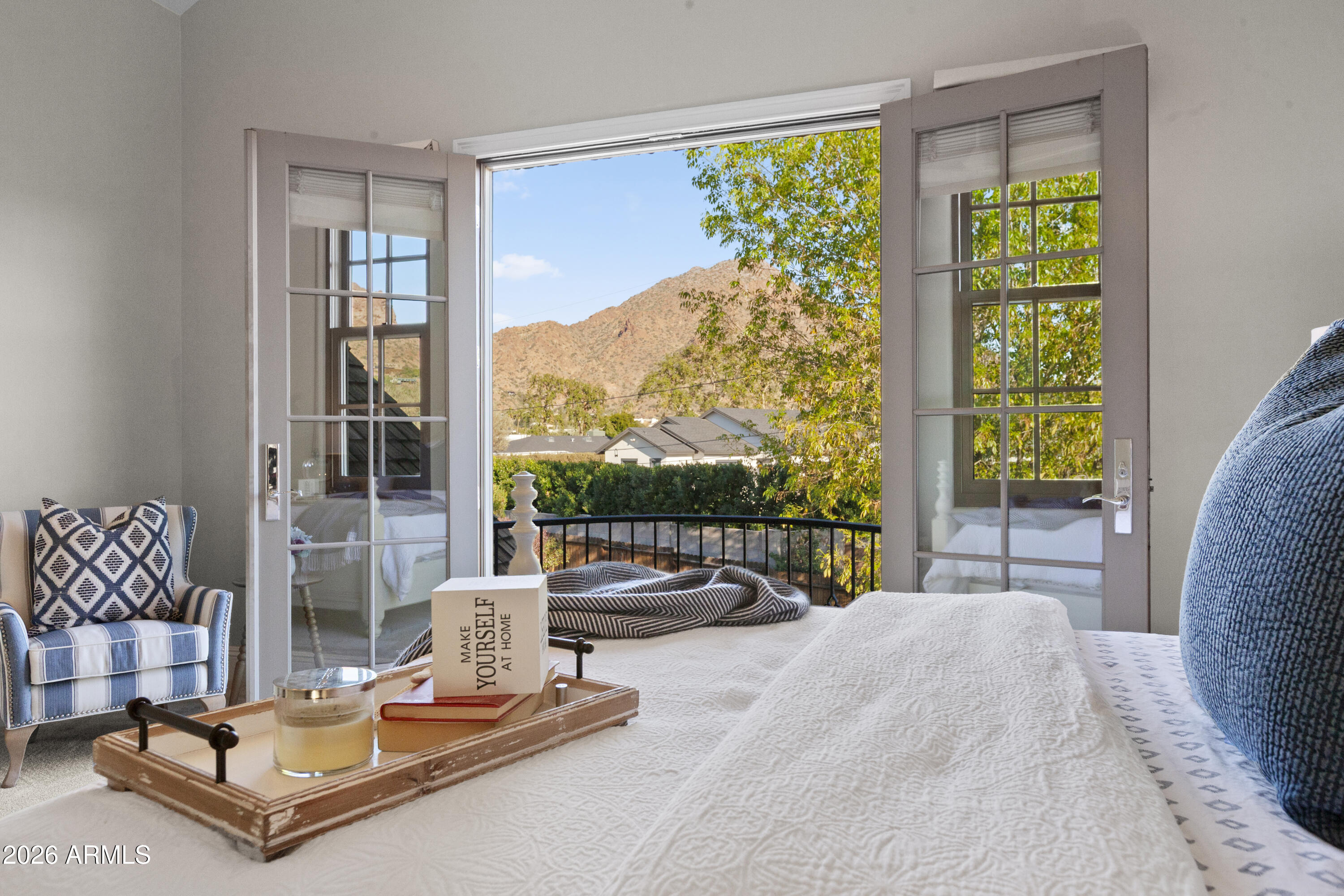 4909 North 45th Place Phoenix, AZ 85018 - Photo 29 of 45 a view of a living room with a floor to ceiling window and floor to ceiling window
