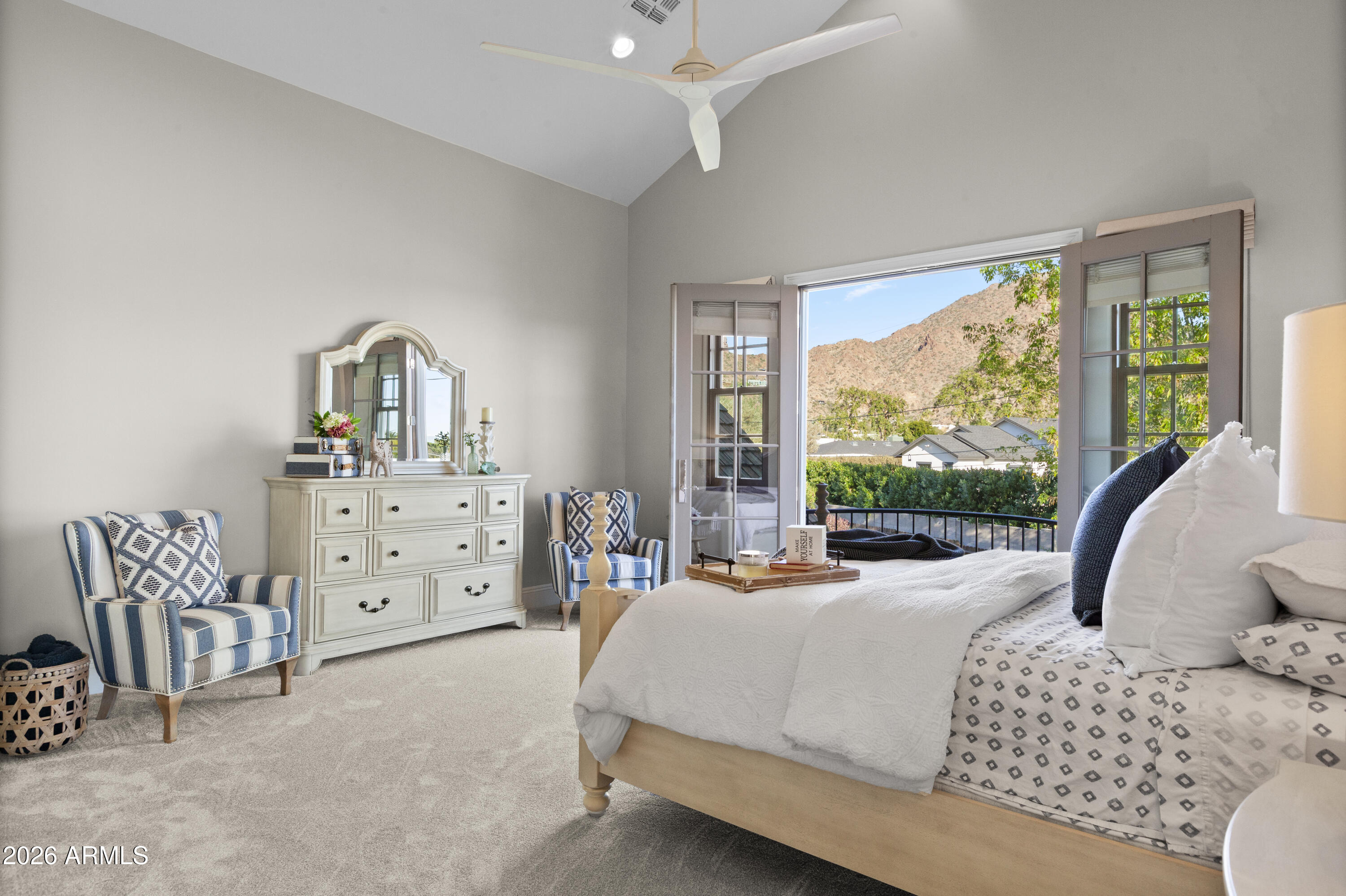 4909 North 45th Place Phoenix, AZ 85018 - Photo 30 of 45 a bedroom with a bed chair and double door