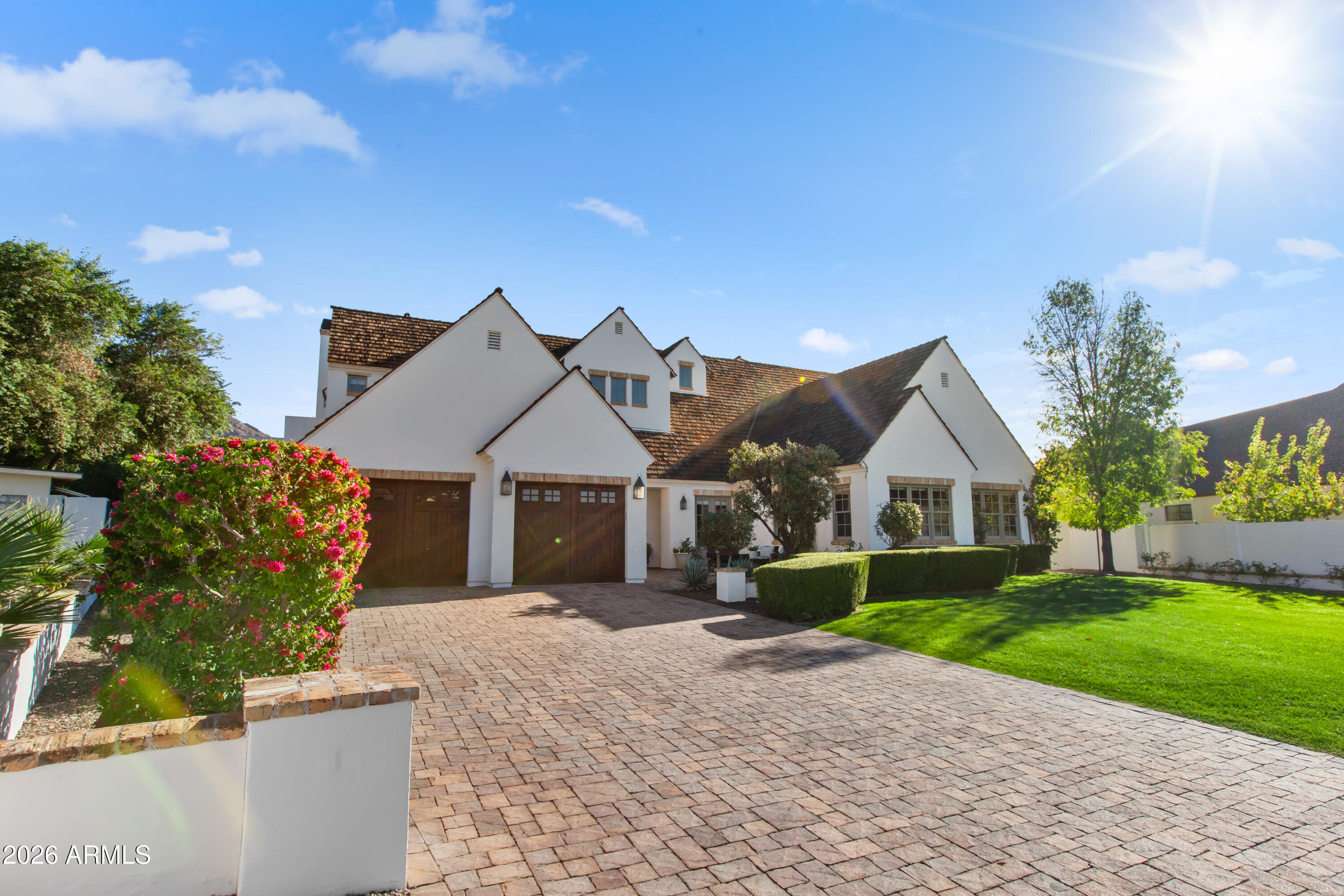 4909 North 45th Place Phoenix, AZ 85018 - Photo 3 of 45 front view of a house with a yard