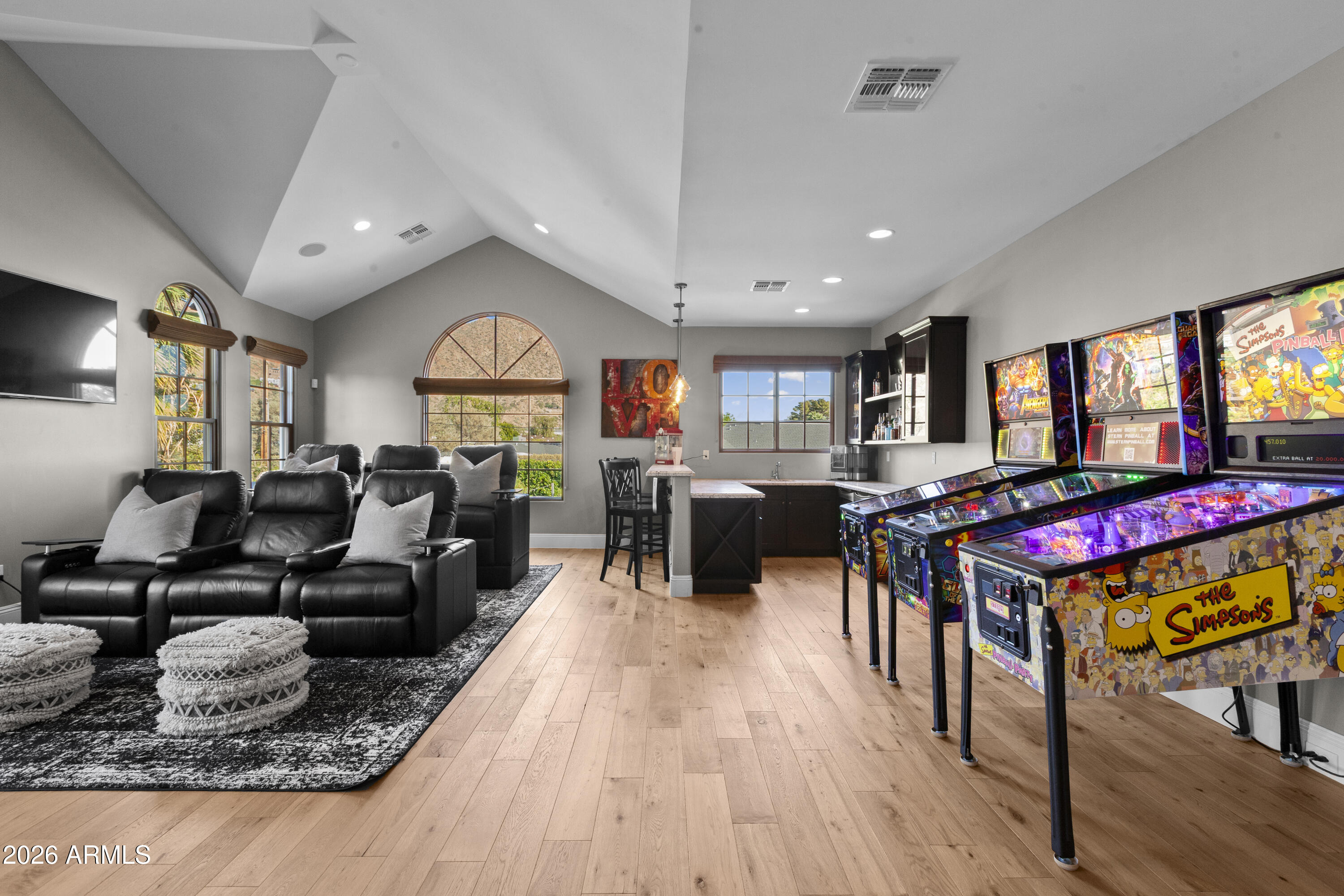 4909 North 45th Place Phoenix, AZ 85018 - Photo 36 of 45 a living room with furniture kitchen view and a wooden floor
