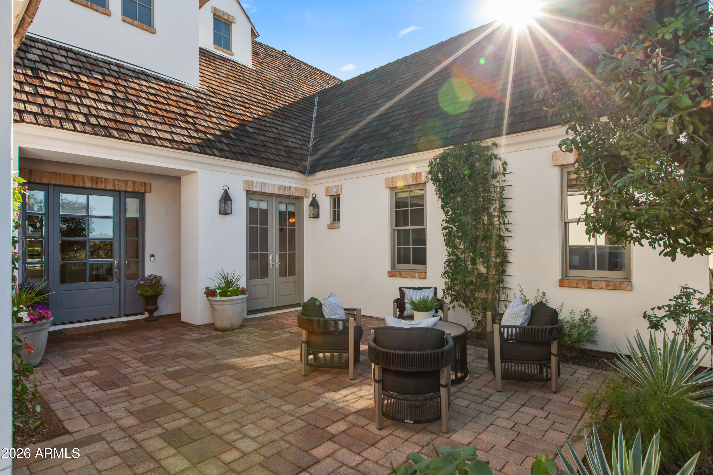 4909 North 45th Place Phoenix, AZ 85018 - Photo 4 of 45 a backyard of a house with table and chairs