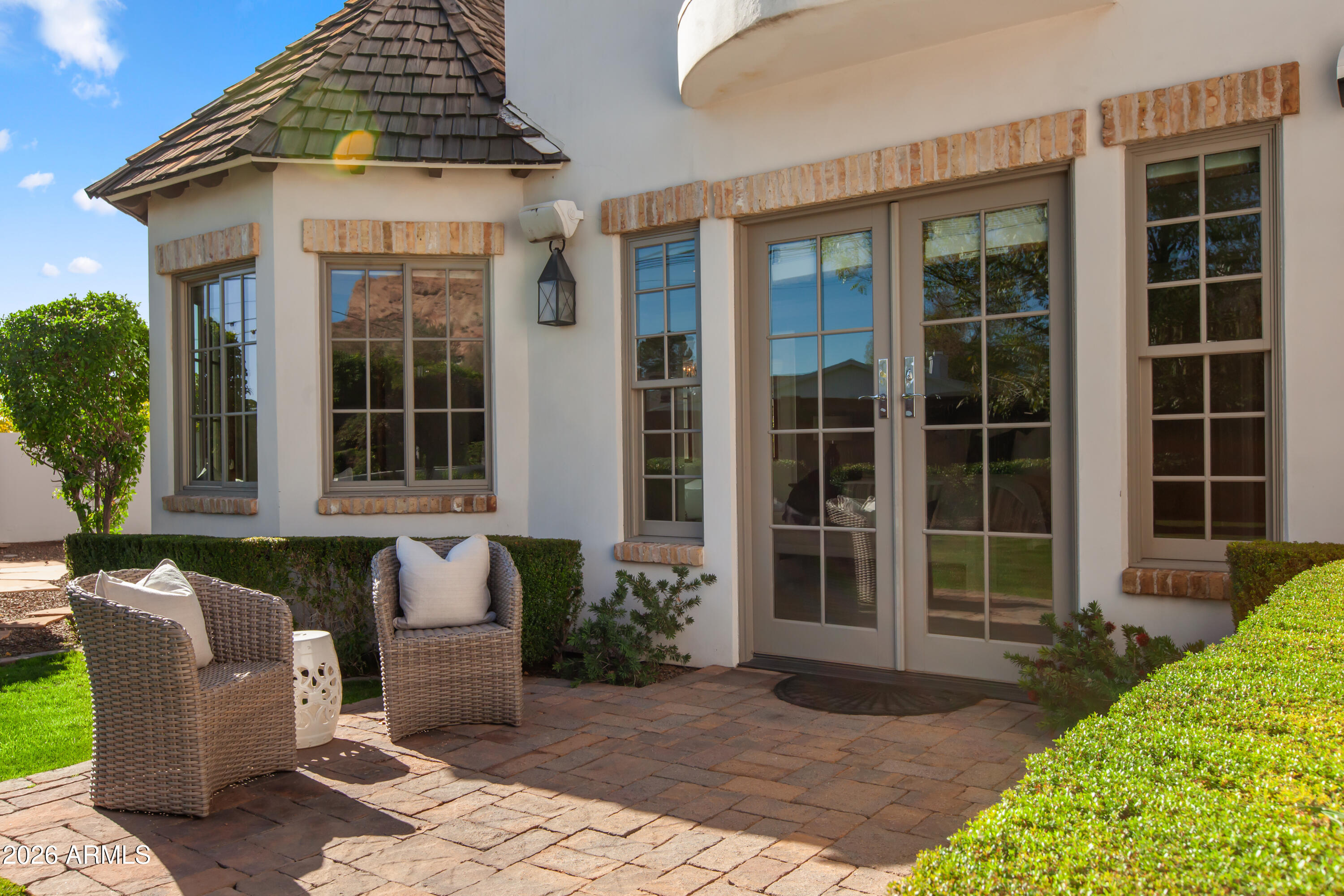 4909 North 45th Place Phoenix, AZ 85018 - Photo 6 of 45 a front view of a house with a garden
