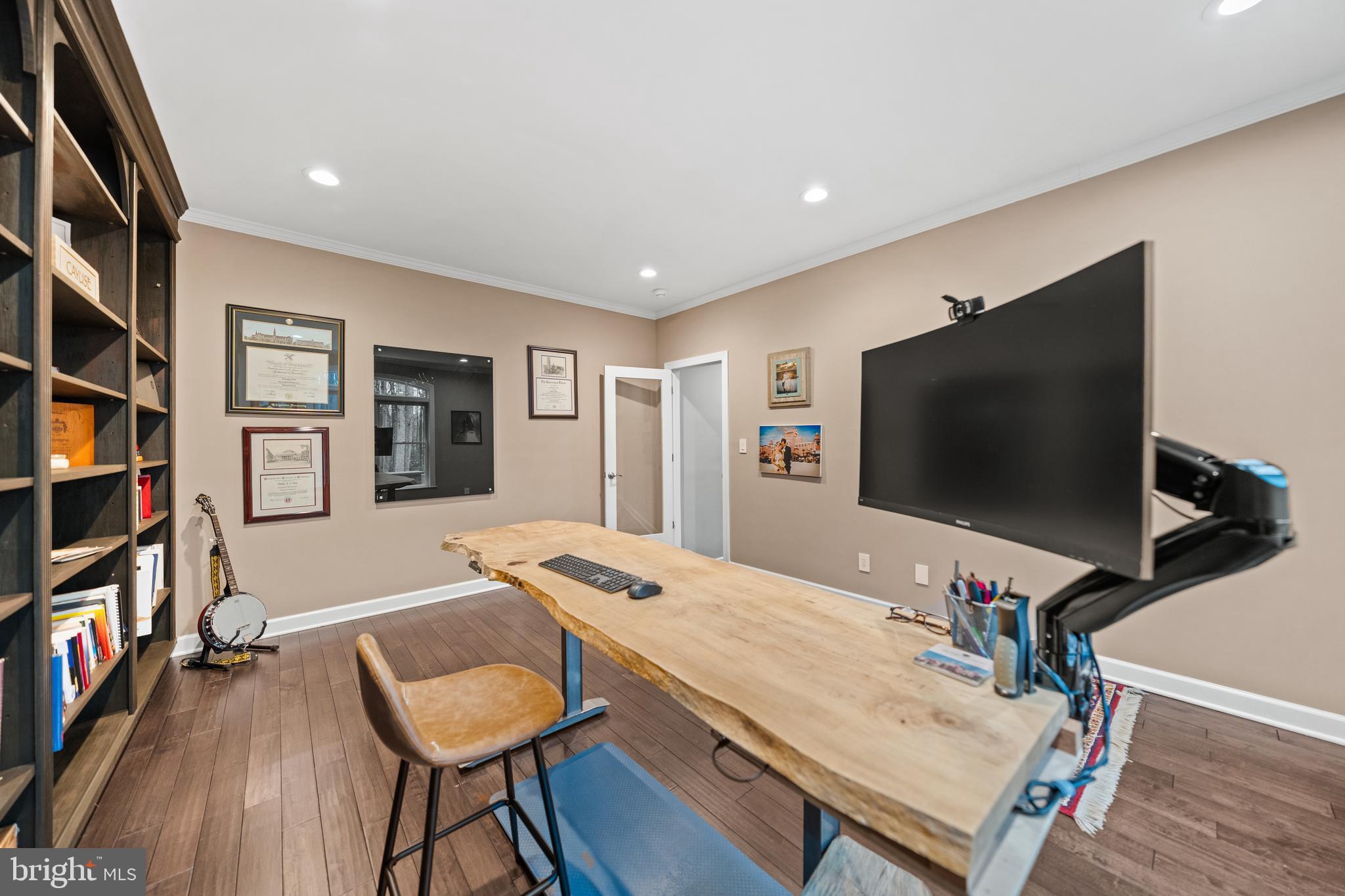 642 Springvale Road Great Falls, VA 22066 - Photo 17 of 50 a living room with furniture and a flat screen tv