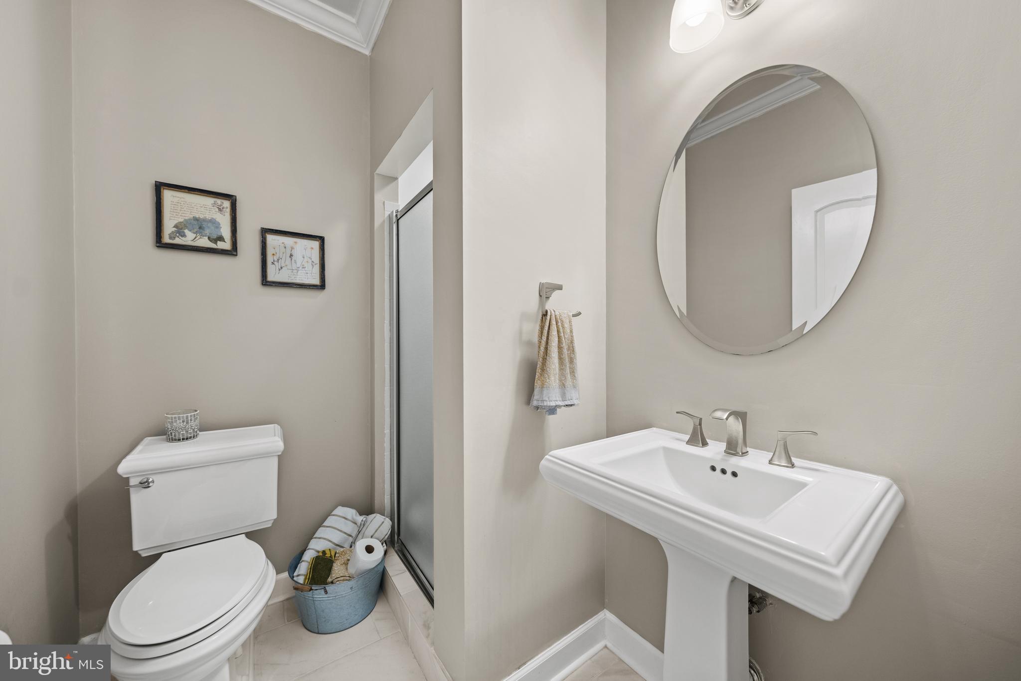 642 Springvale Road Great Falls, VA 22066 - Photo 19 of 50 a white toilet sitting next to a bathroom sink