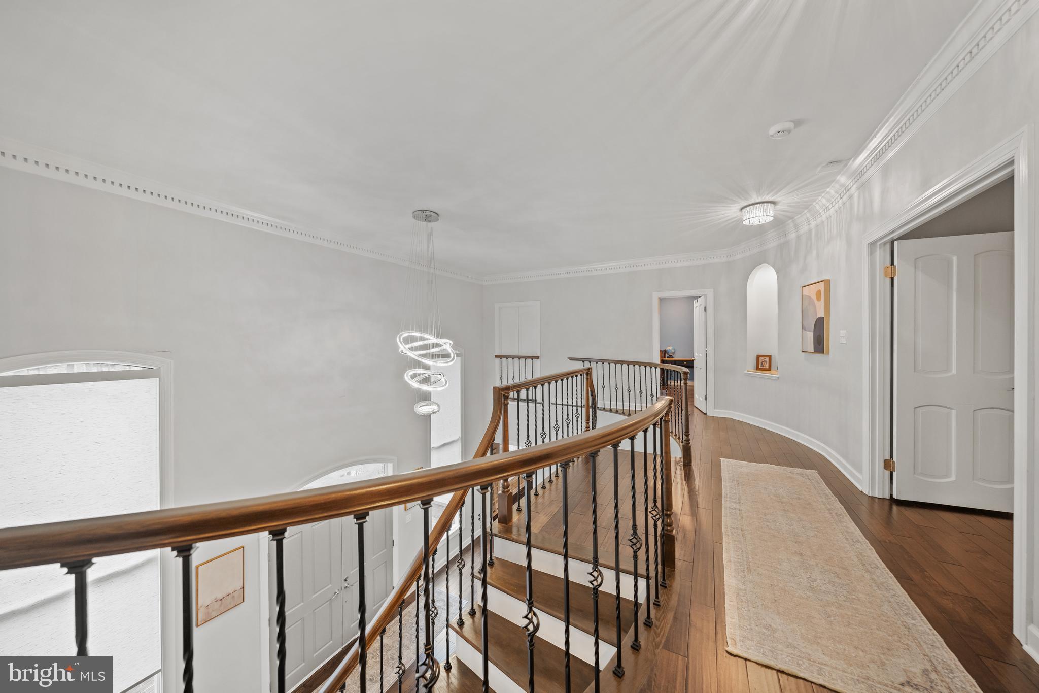 642 Springvale Road Great Falls, VA 22066 - Photo 21 of 50 a view of staircase with railing and white walls