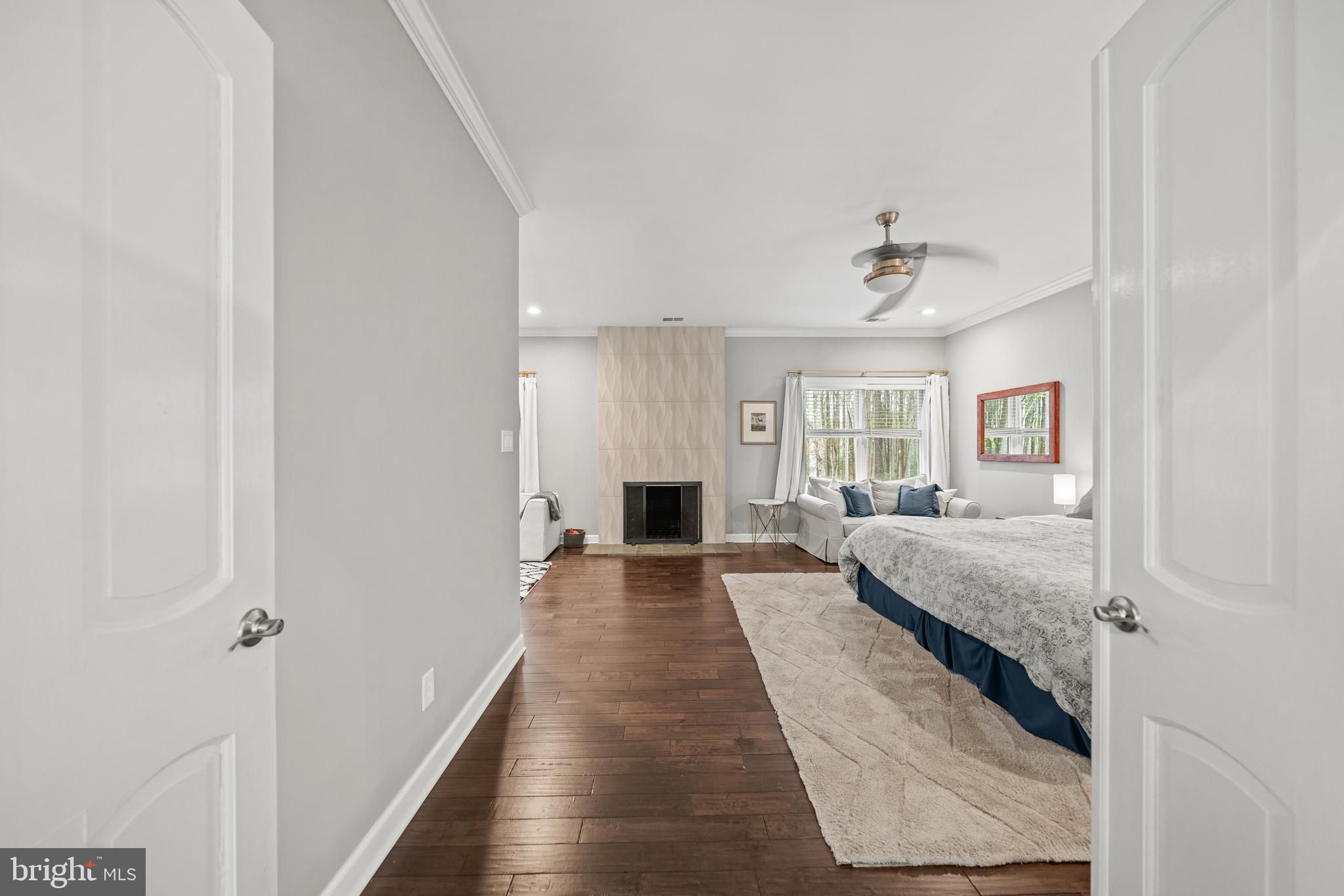 642 Springvale Road Great Falls, VA 22066 - Photo 23 of 50 a hallway with a couches and a fireplace