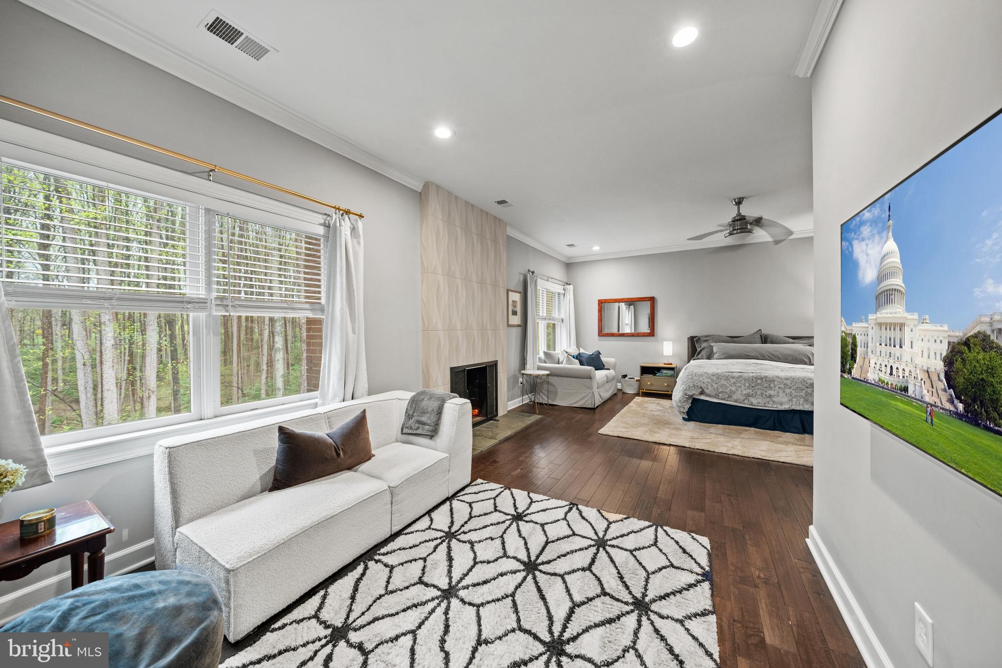642 Springvale Road Great Falls, VA 22066 - Photo 25 of 50 a bedroom with furniture and a large window