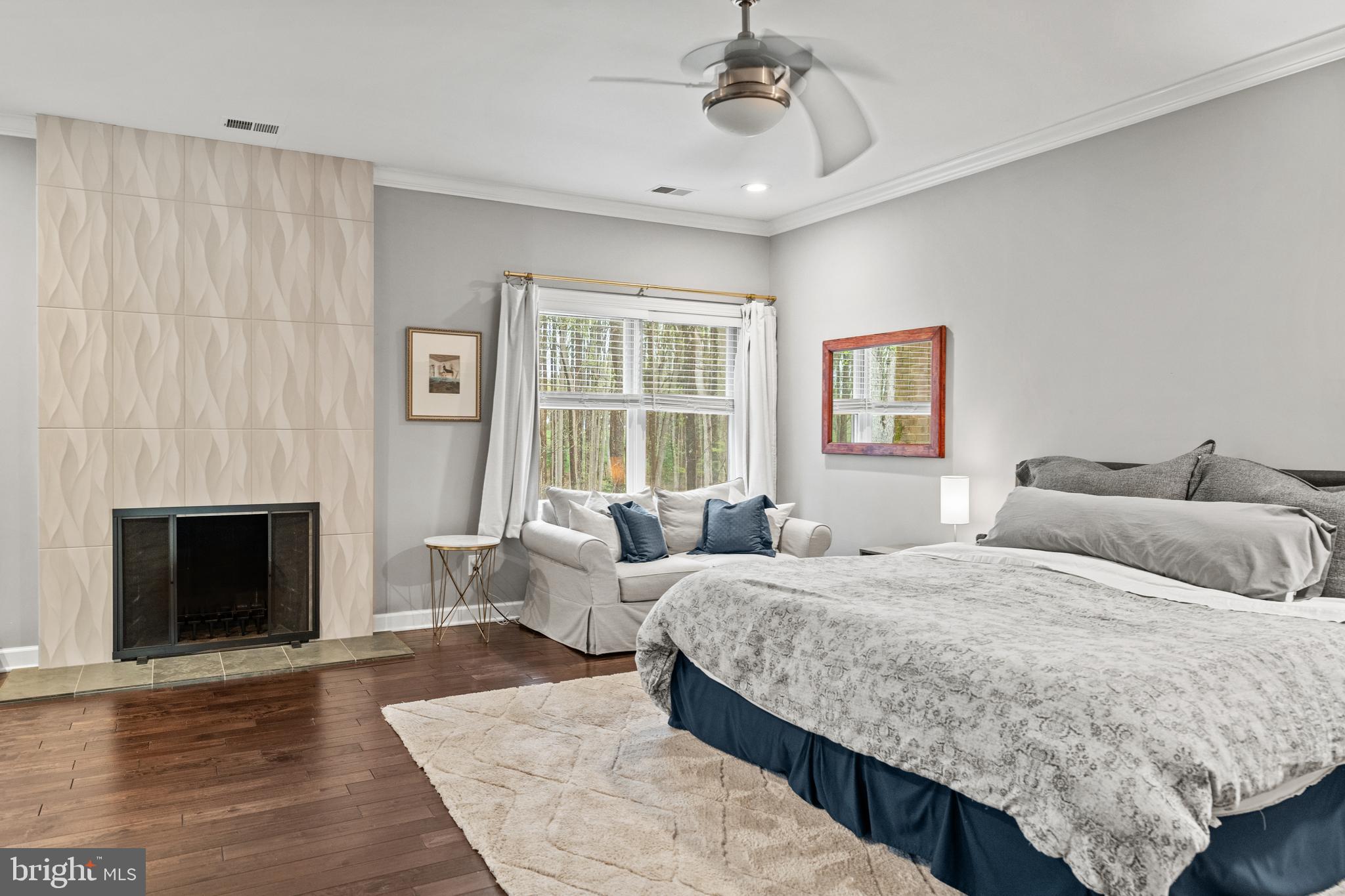 642 Springvale Road Great Falls, VA 22066 - Photo 26 of 50 a bedroom with a bed and a fireplace