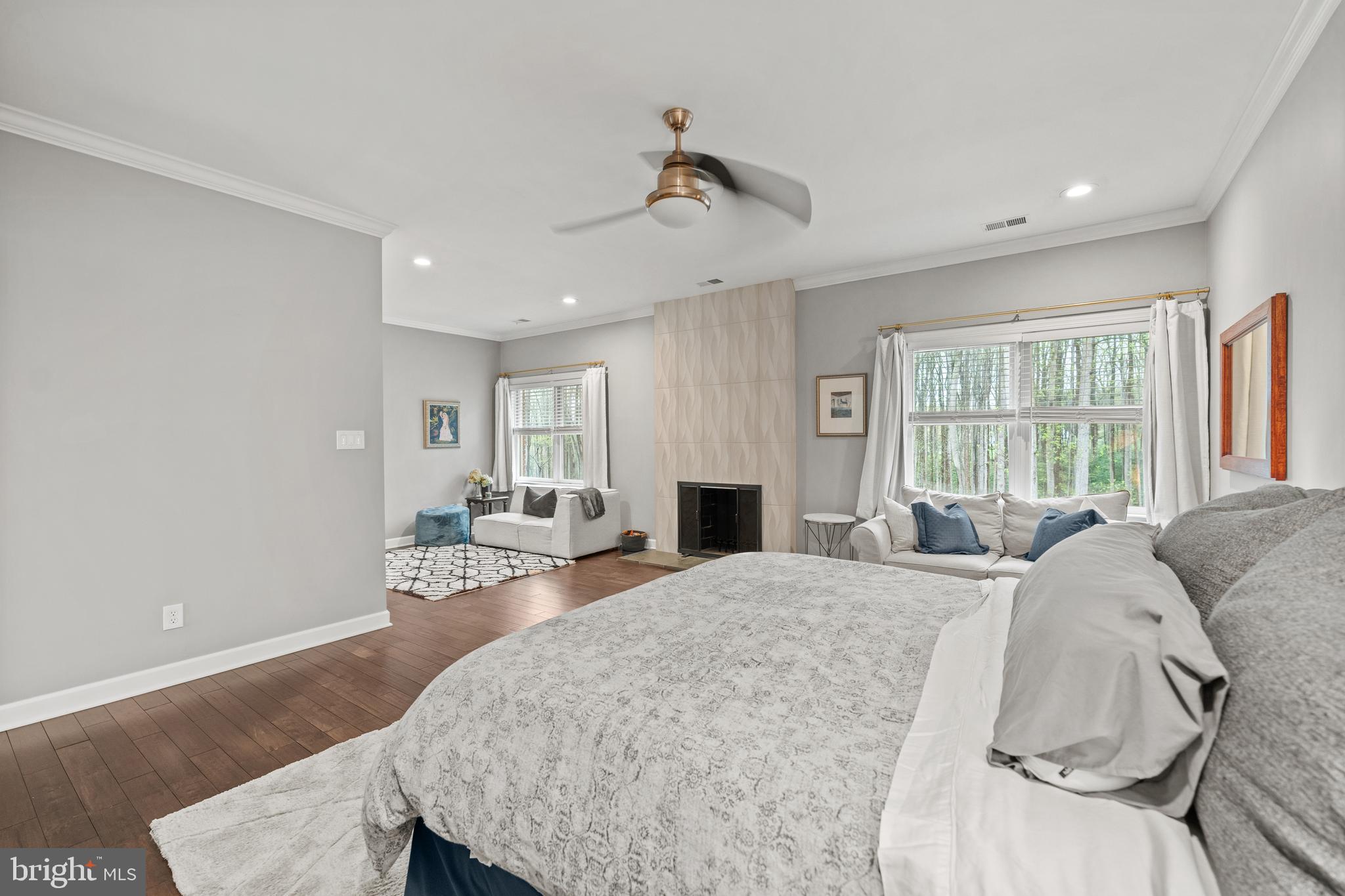 642 Springvale Road Great Falls, VA 22066 - Photo 27 of 50 a living room with furniture a fireplace and a table