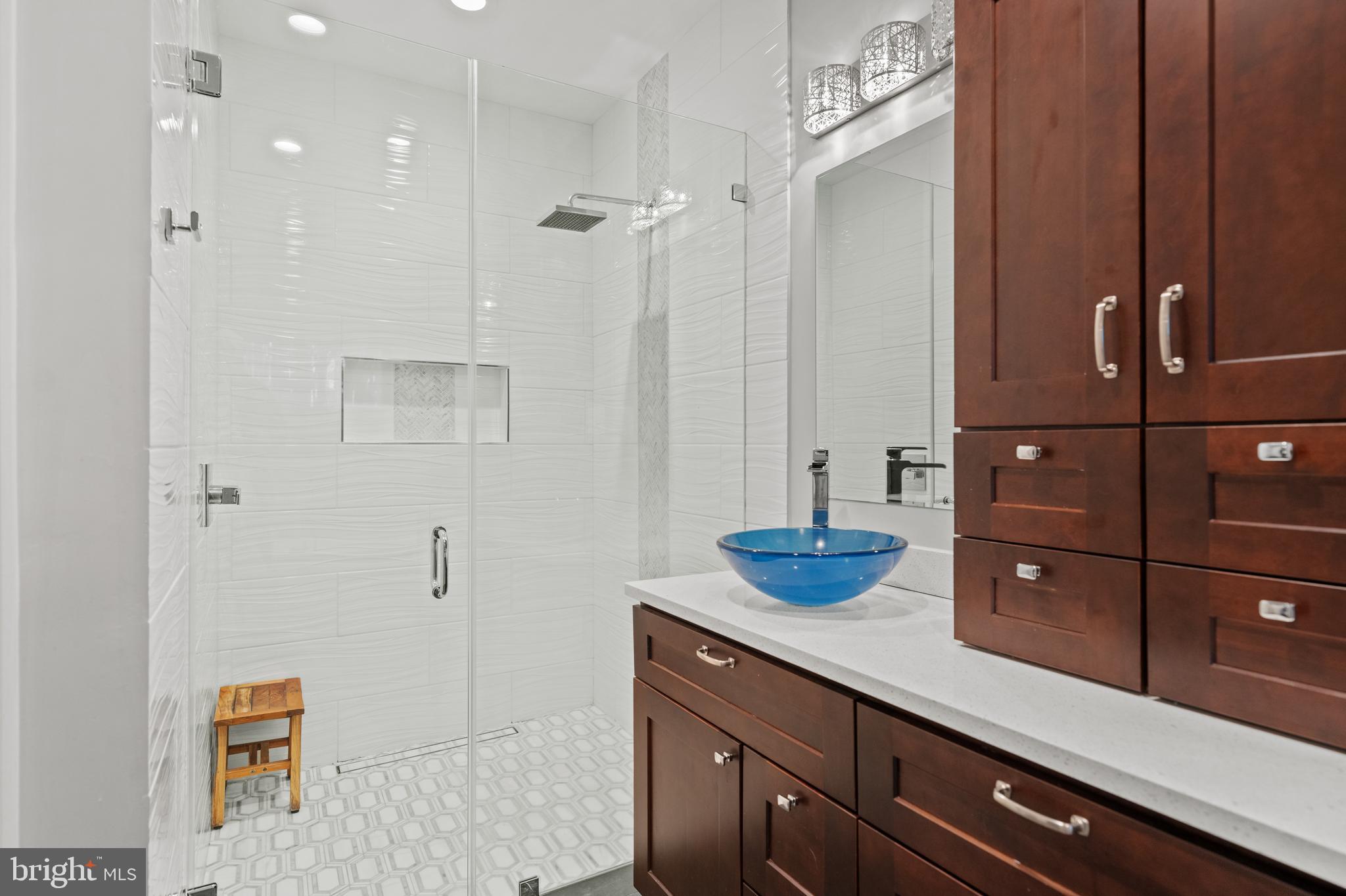 642 Springvale Road Great Falls, VA 22066 - Photo 30 of 50 a bathroom with a sink and a mirror