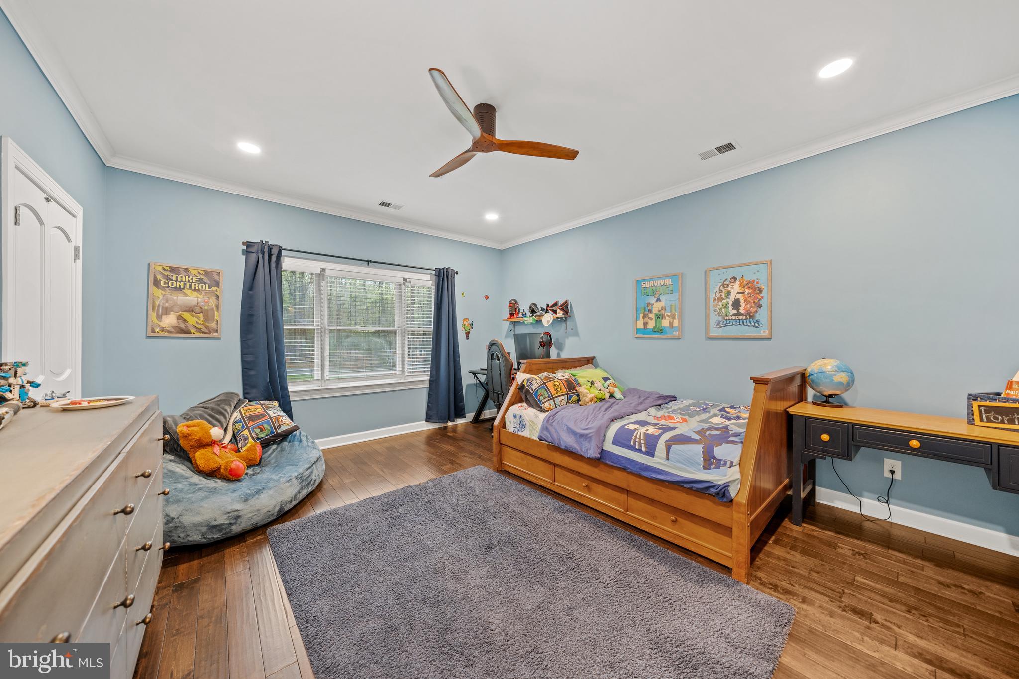 642 Springvale Road Great Falls, VA 22066 - Photo 34 of 50 a bedroom with a bed and wooden floor