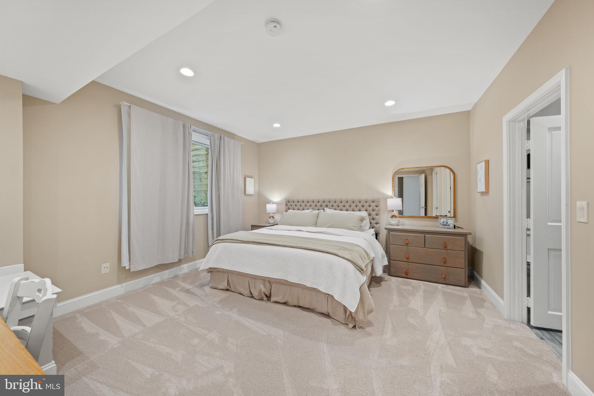 642 Springvale Road Great Falls, VA 22066 - Photo 40 of 50 a bedroom with a large bed and a dresser