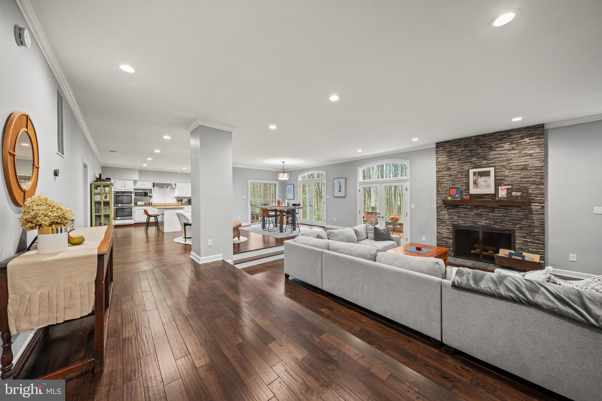 642 Springvale Road Great Falls, VA 22066 - Photo 4 of 50 a living room with furniture and a fireplace