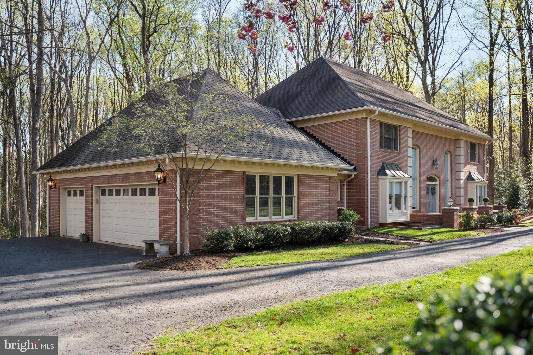 642 Springvale Road Great Falls, VA 22066 - Photo 49 of 50 a front view of a house with a yard