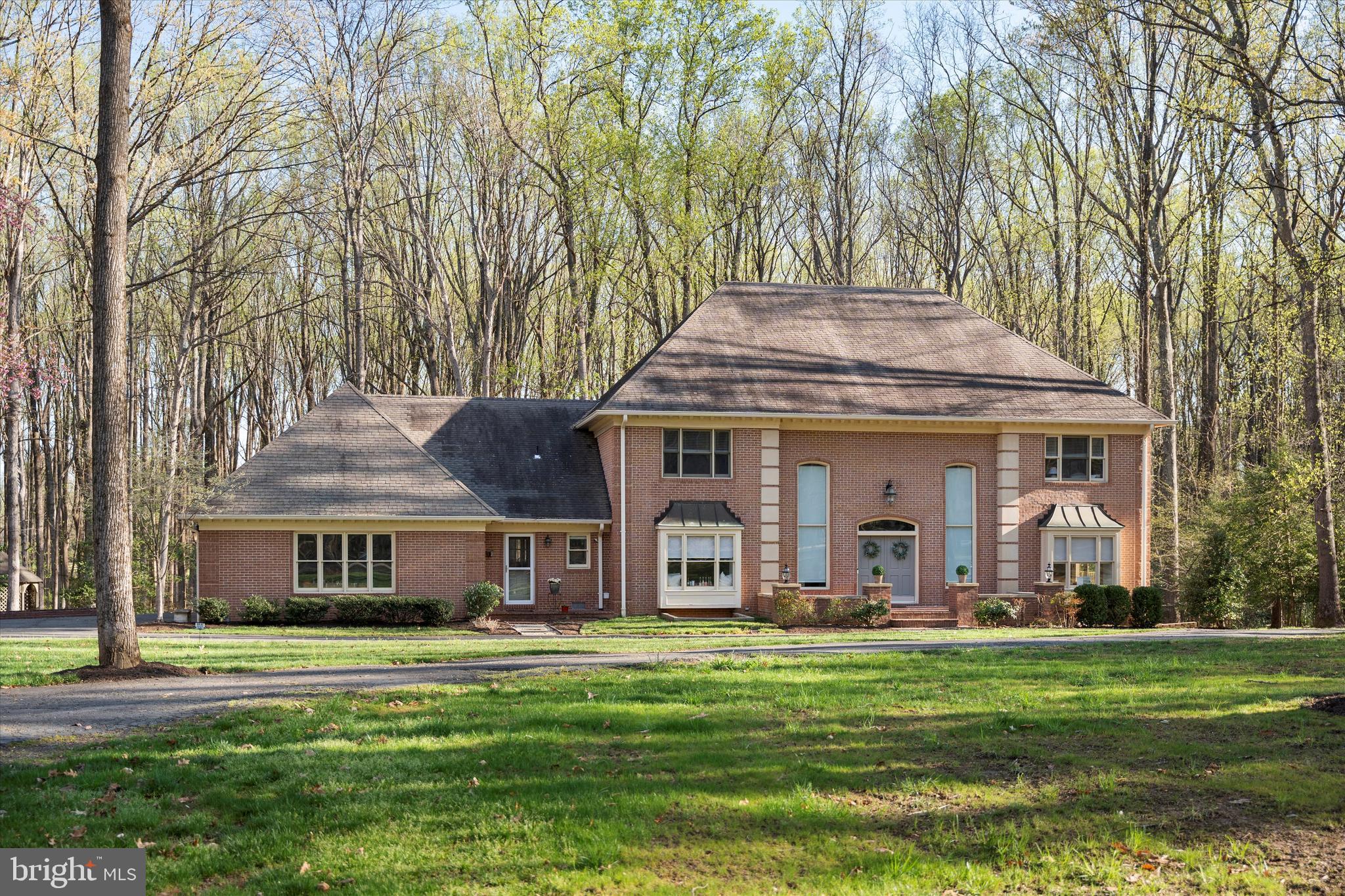 642 Springvale Road Great Falls, VA 22066 - Photo 50 of 50 a front view of a house with a garden