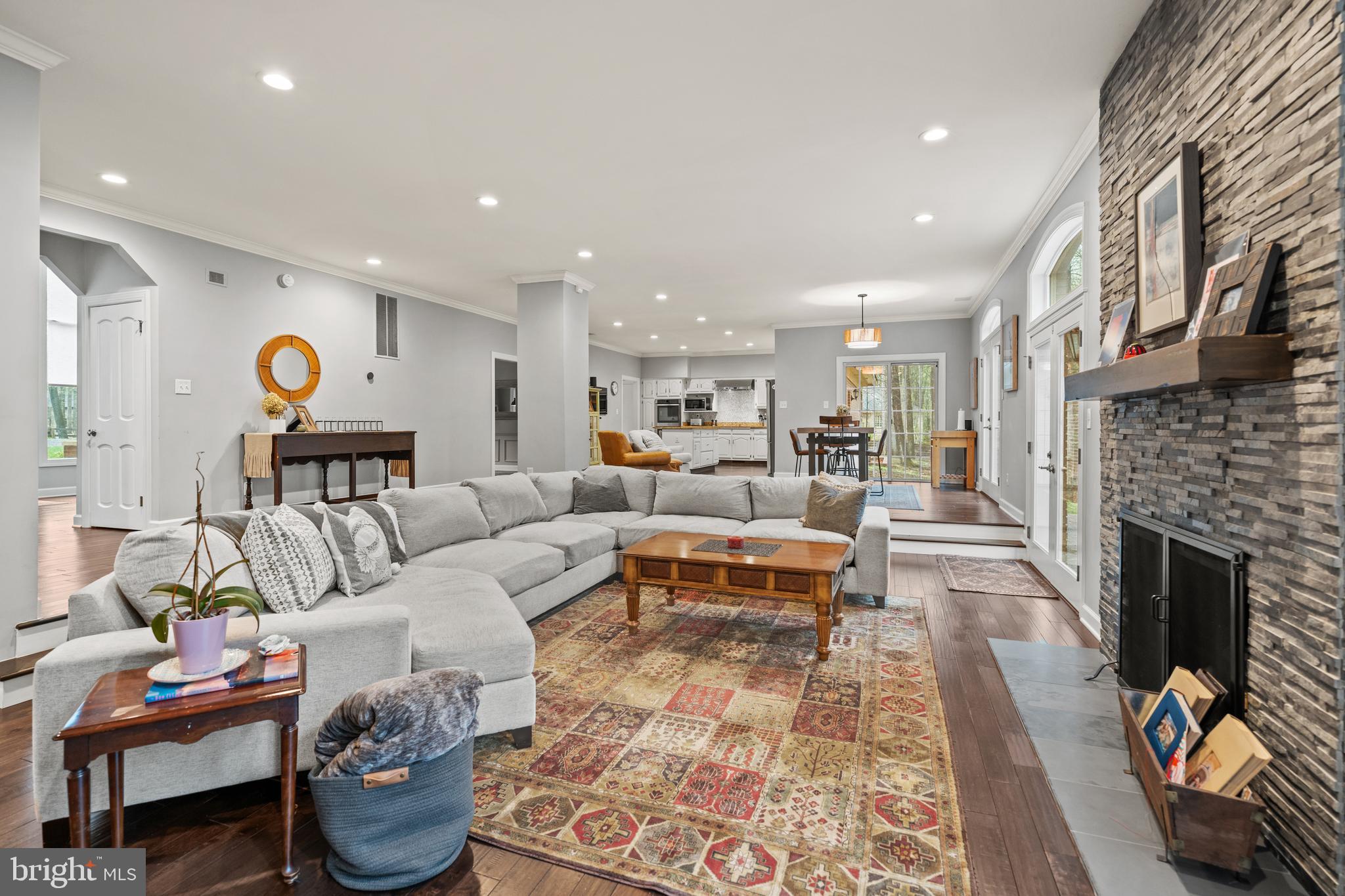 642 Springvale Road Great Falls, VA 22066 - Photo 6 of 50 a living room with furniture fireplace and a fireplace