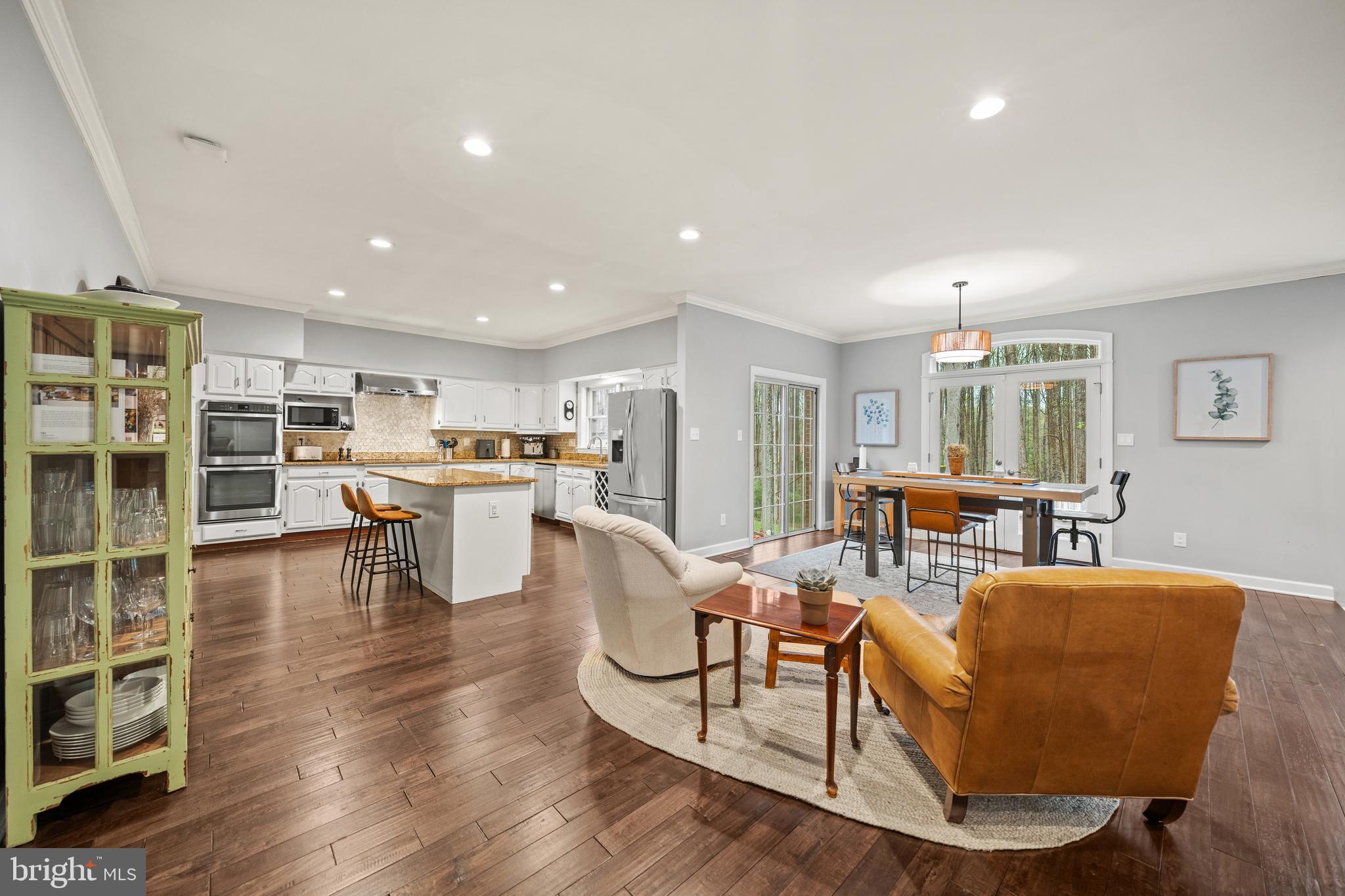 642 Springvale Road Great Falls, VA 22066 - Photo 7 of 50 a living room with furniture and view of kitchen