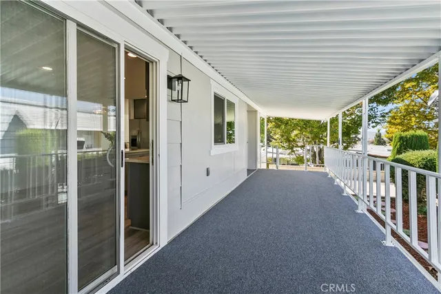 a kitchen that has a lot of cabinets in it and wooden floors