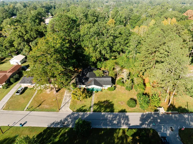 an aerial view of residential houses with outdoor space