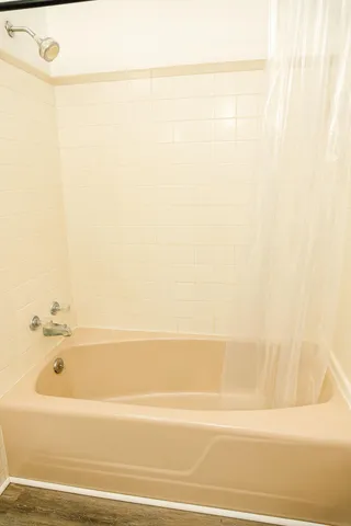 a bathroom with a sink toilet and mirror