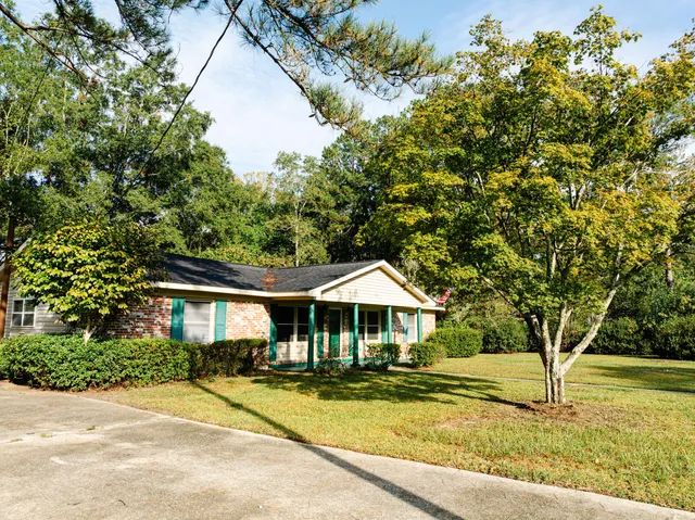 a view of a backyard with sitting area