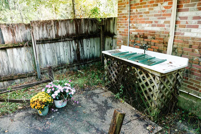 a view of a house with a yard and garage