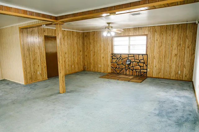 a bedroom with a bed and a night stand