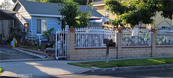 a view of a house with a street