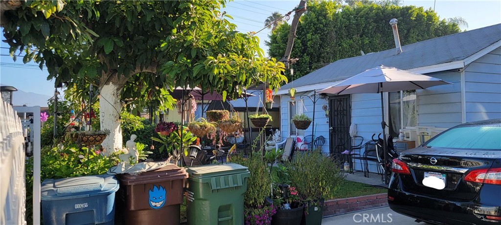 4014 Cedar Avenue El Monte, CA 91731 - Photo 5 of 5 a view of a patio with table and chairs potted plants