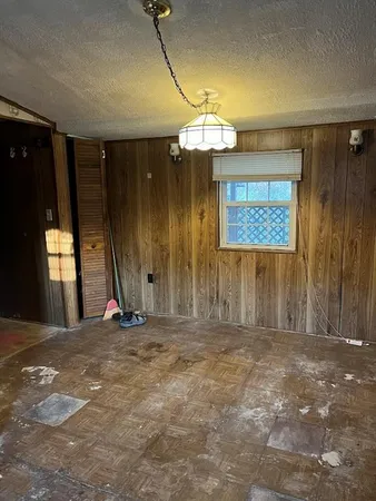 a kitchen with a refrigerator and a stove top oven
