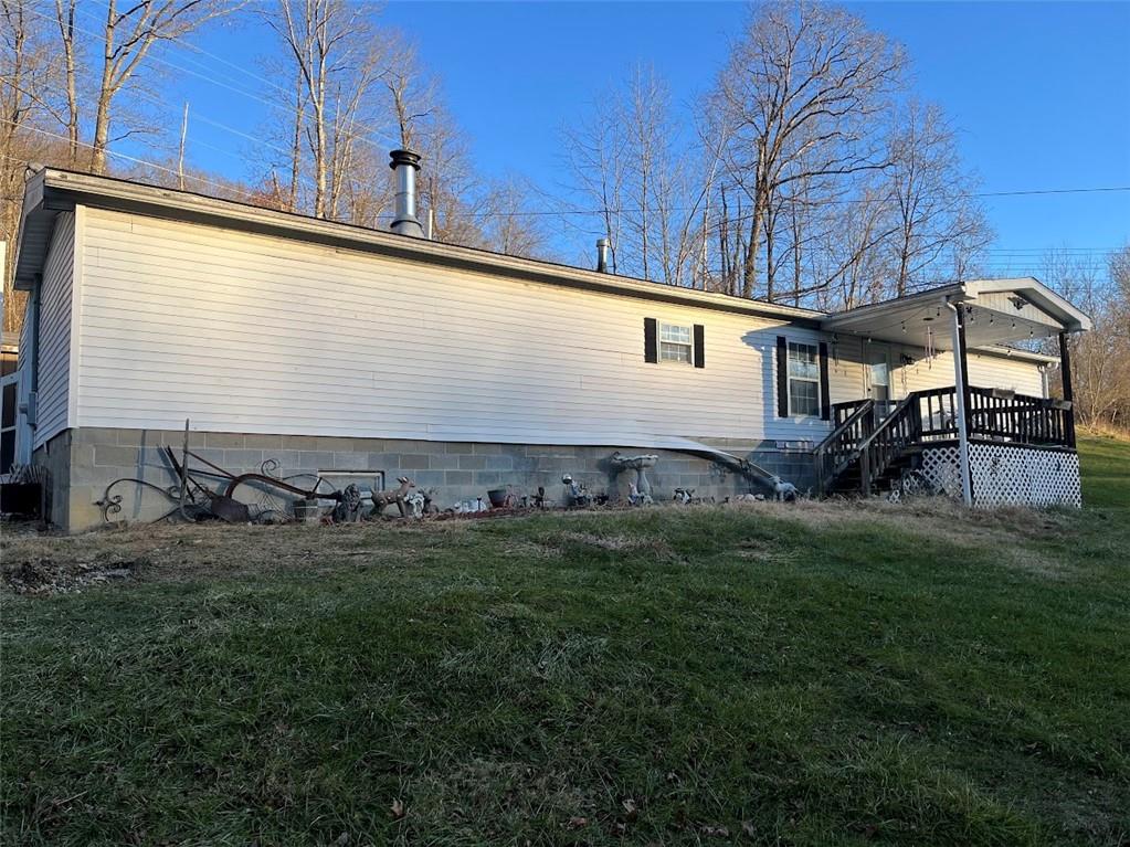 266 Tollgate Run Waynesburg, PA 15370 - Photo 2 of 20 a front view of a house with a garden