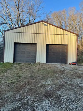 a view of large house with a garage