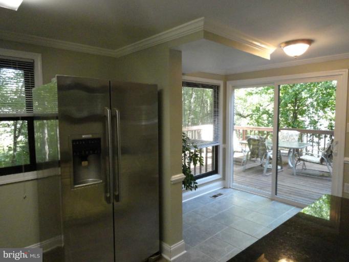 2343 Old Trail Drive Reston, VA 20191 - Photo 13 of 24 Table space kitchen looks out on deck