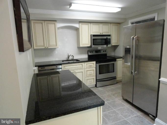 2343 Old Trail Drive Reston, VA 20191 - Photo 15 of 24 Updated kitchen with subway tile backsplash