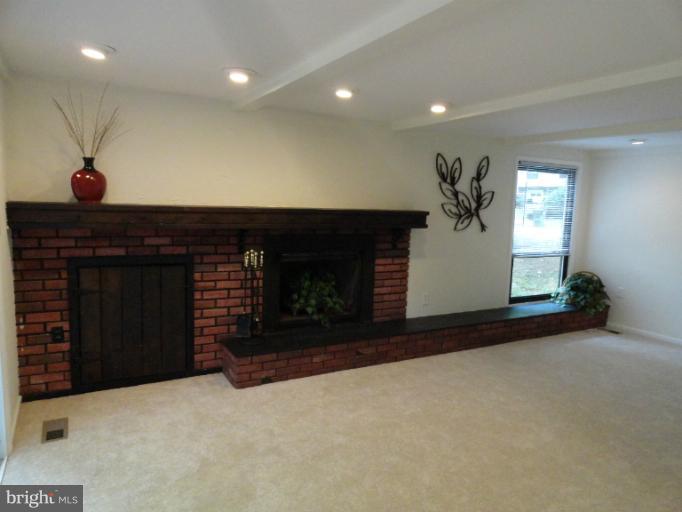 2343 Old Trail Drive Reston, VA 20191 - Photo 5 of 24 Family Room with fireplace and beamed ceilings