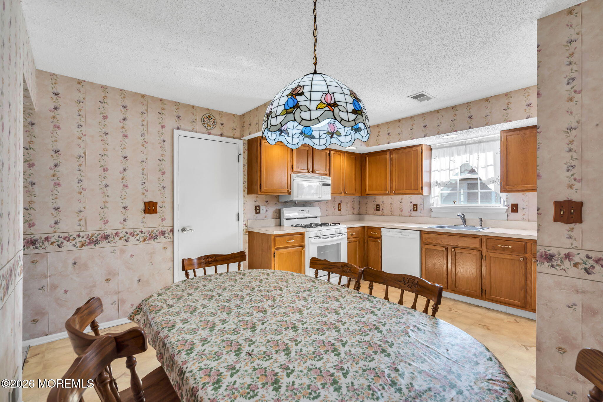 13 Golden Rod Court Brick, NJ 08724 - Photo 15 of 39 a kitchen with stainless steel appliances kitchen island granite countertop a sink and cabinets