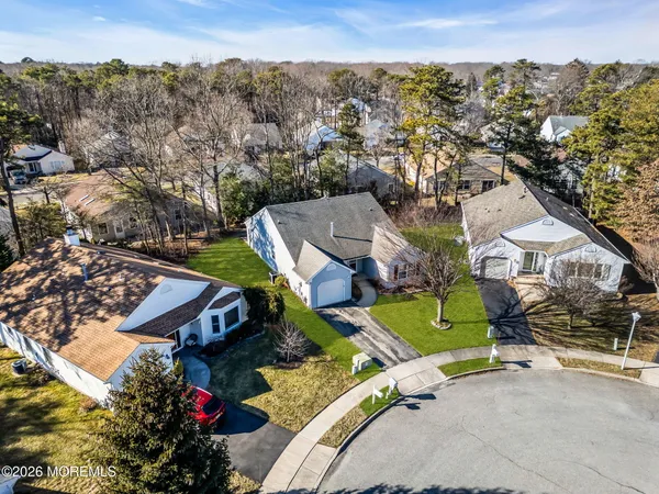 an aerial view of a house with a garden