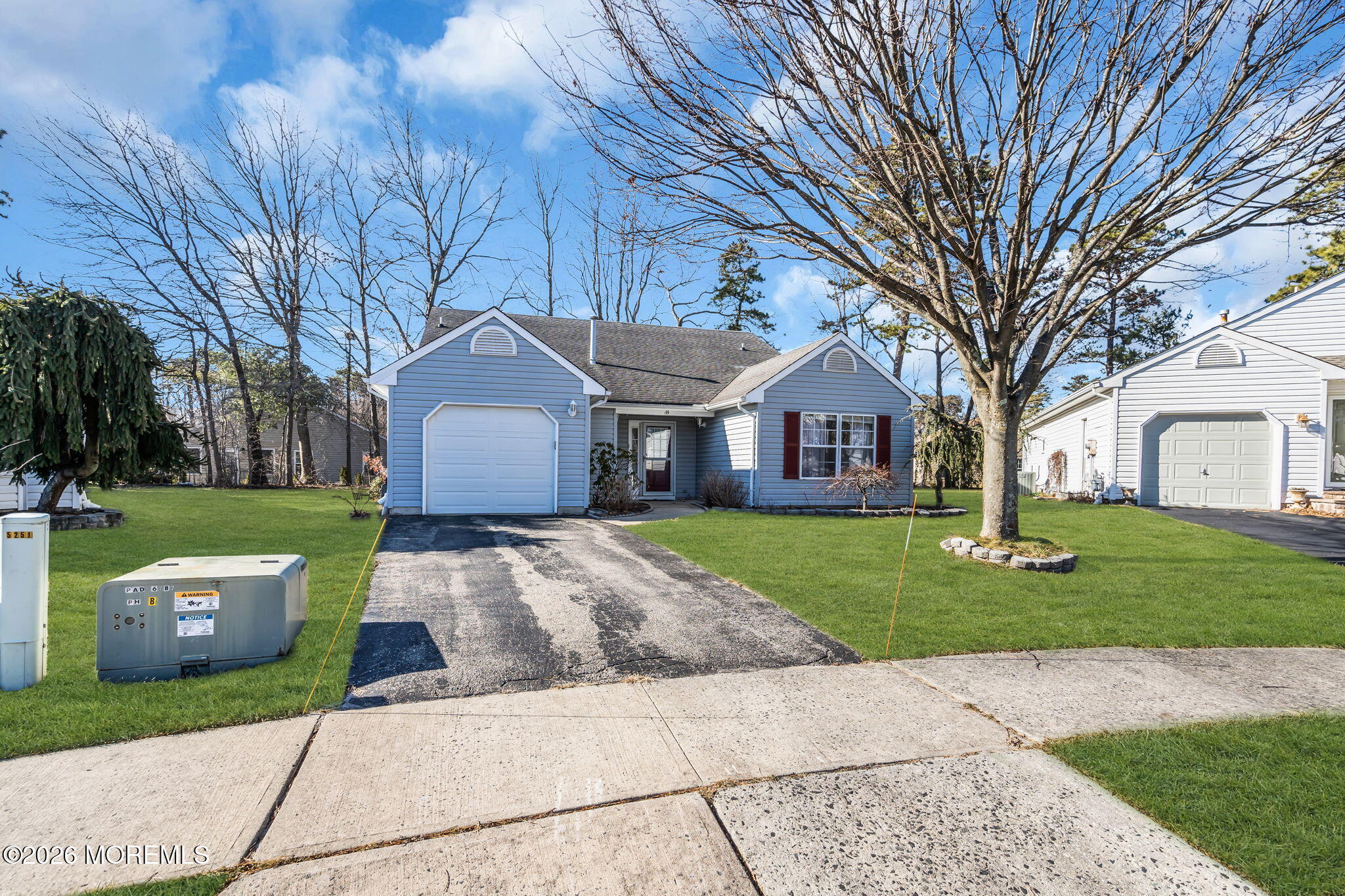 13 Golden Rod Court Brick, NJ 08724 - Photo 3 of 39 a front view of a house with a yard and garage