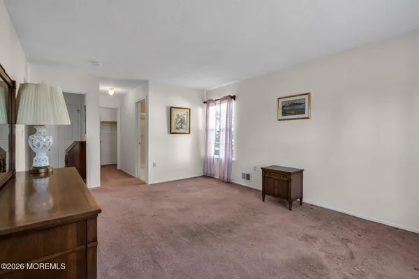a view of livingroom with furniture and a flat screen tv