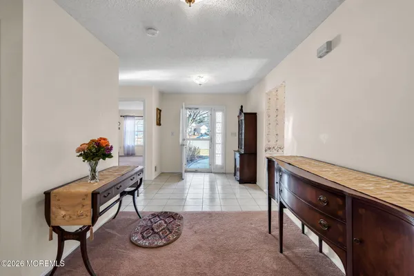a living room with furniture and a table