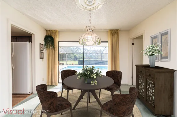 a view of a livingroom with furniture and a window