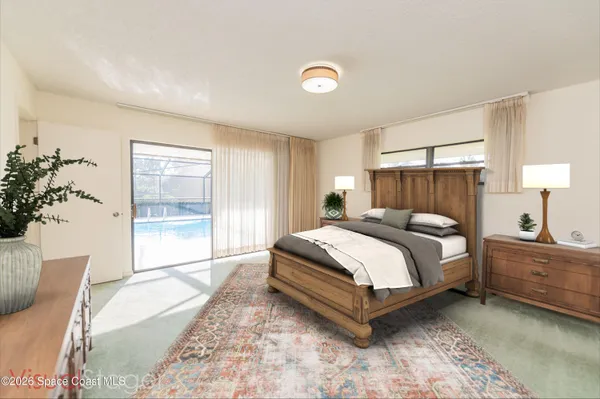 a bedroom with a large bed and lamp with window