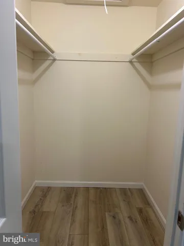 a view of an empty walk in closet
