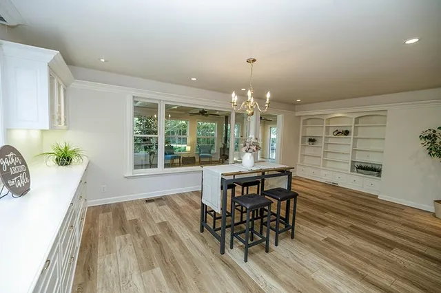 a view of a dining room with furniture window and wooden floor