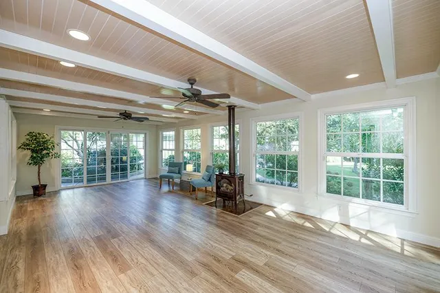 a view of a livingroom with furniture window and wooden floor